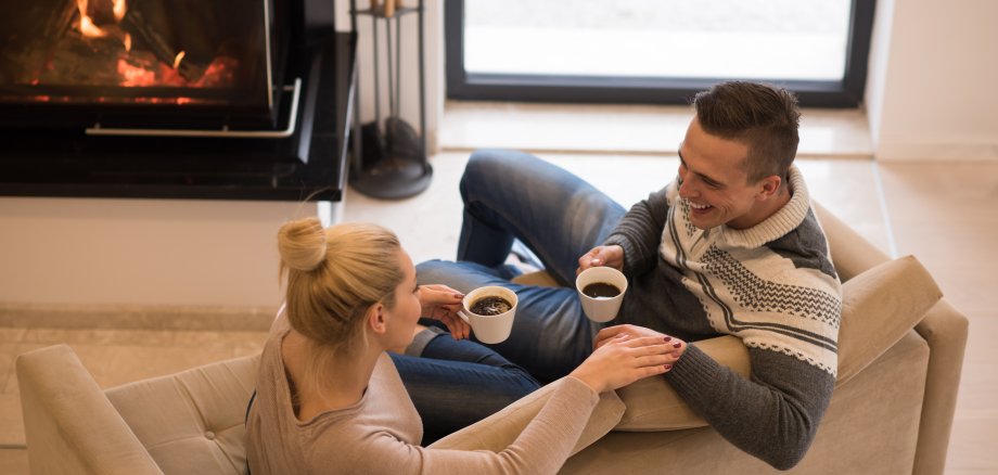 Young couple  in front of fireplace